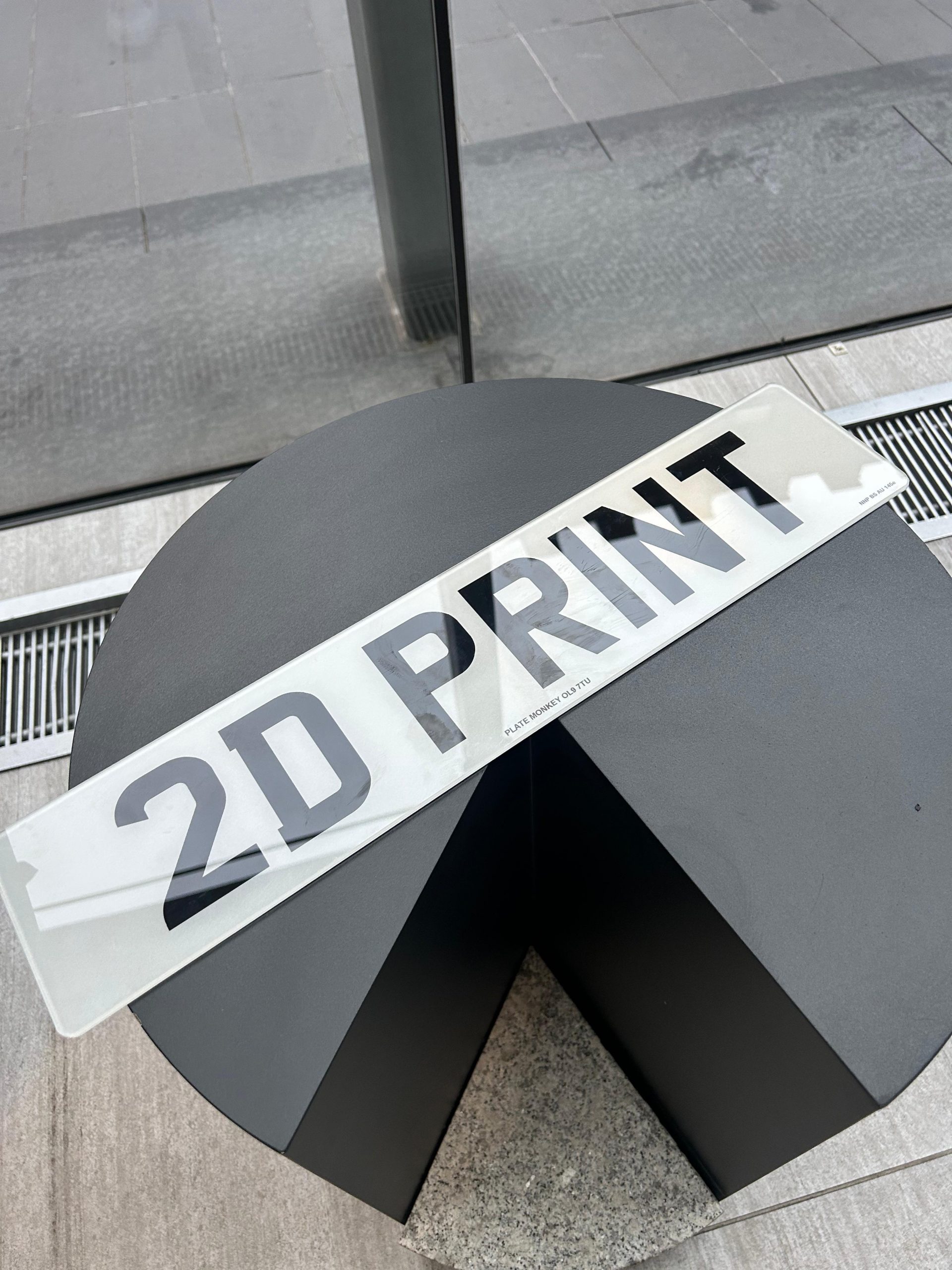 A pair of standard 2D printed number plates.