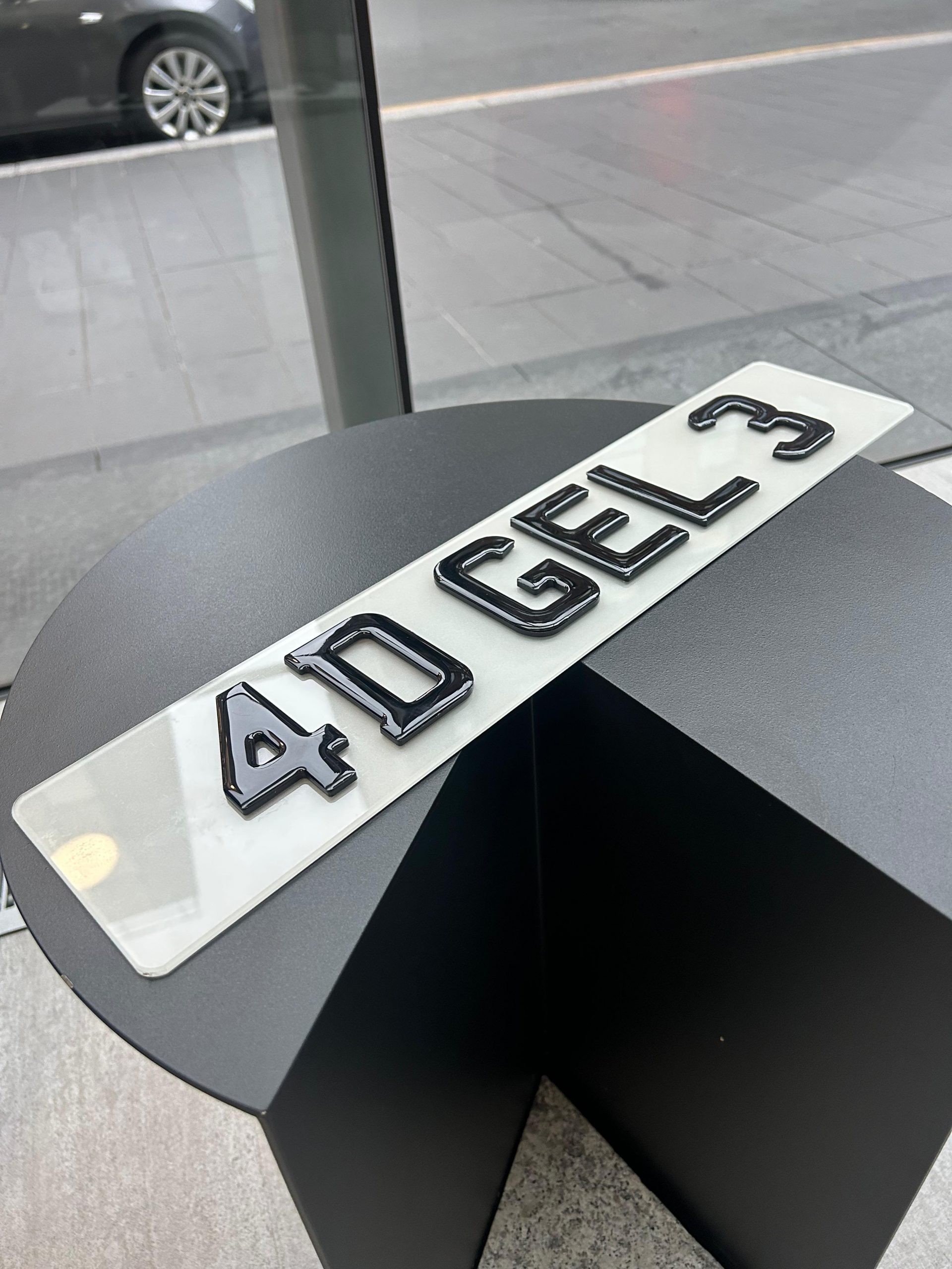 A sleek vehicle fitted with premium 4D style number plates from City Centre Plates.